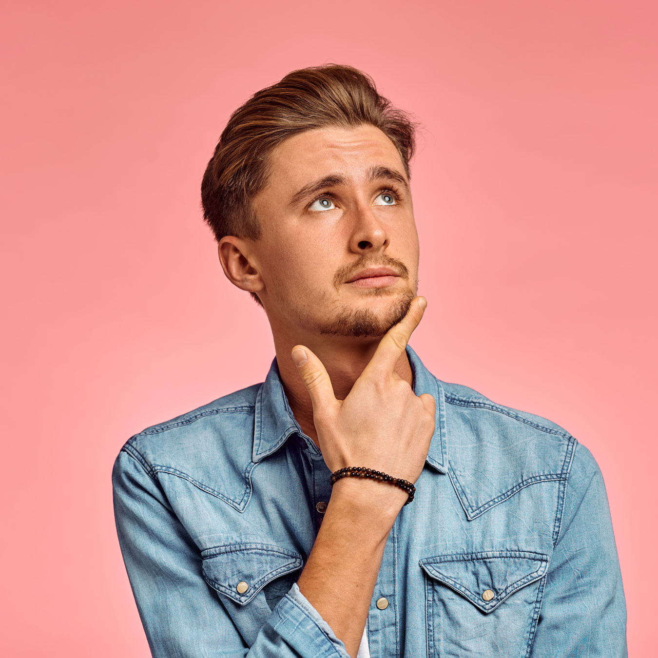 pensive-man-portrait-pink-background-emotion-2022-02-07-23-16-53-utc.jpg